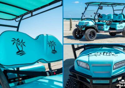 Light blue golf cart on the beach. Seats have palm trees. Front says Salt Life.