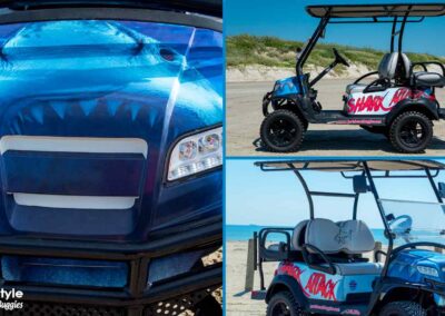 Blue beach buggy with Shark Attack in red letters on the side