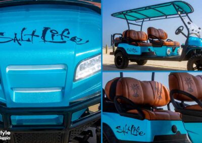 Blue cart with salt life writen on hood. Orange seats
