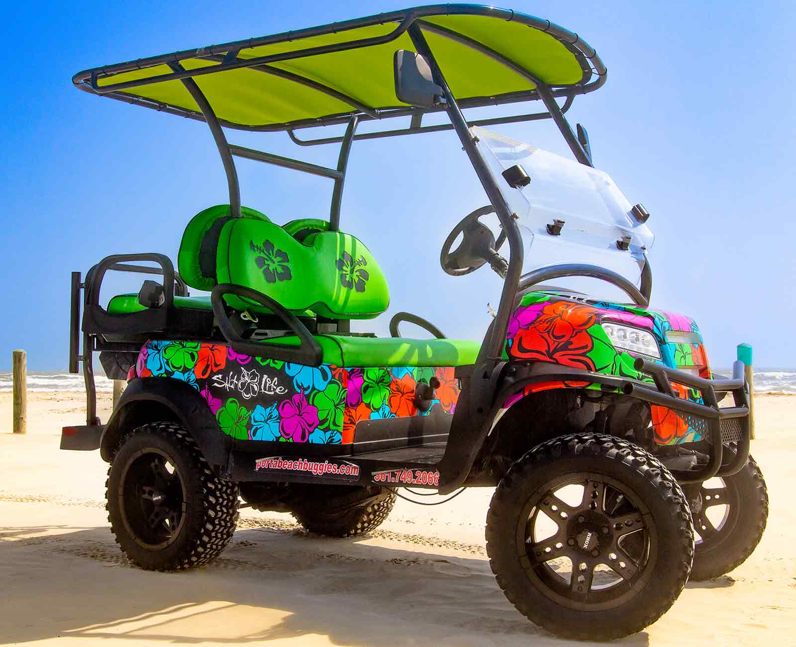 cart with bright multi-color hibiscus flowers and green sets
